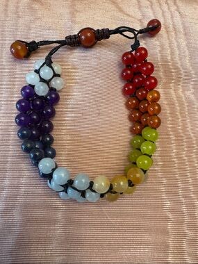 7 Chakra woven bracelet. Multi colored 7 chakra beads. Adjustable barrel knot.